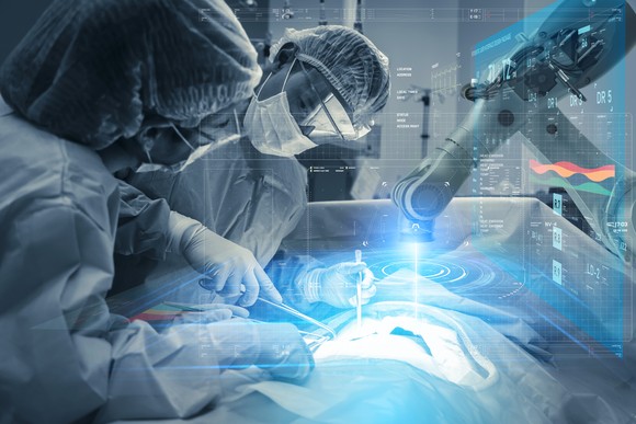 Two surgeons performing an operation with a robotic system.