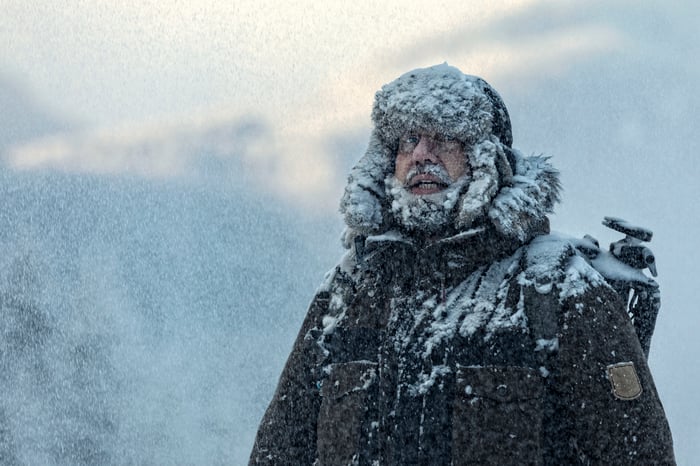Person standing in a snowstorm.