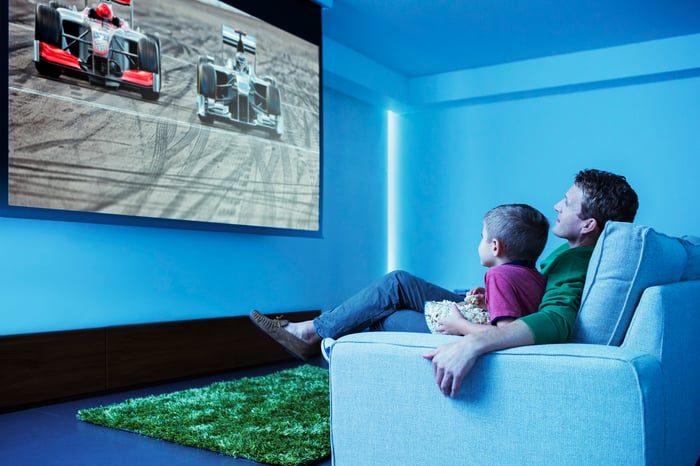 Two people watching television.