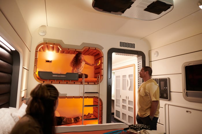 A family checking out the beds and bunk beds on Star Wars: Galactic Starcruiser.