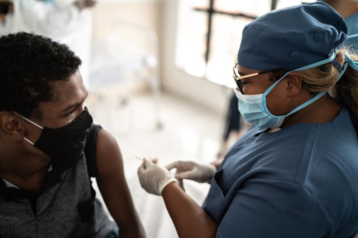A person about to receive a vaccine shot.