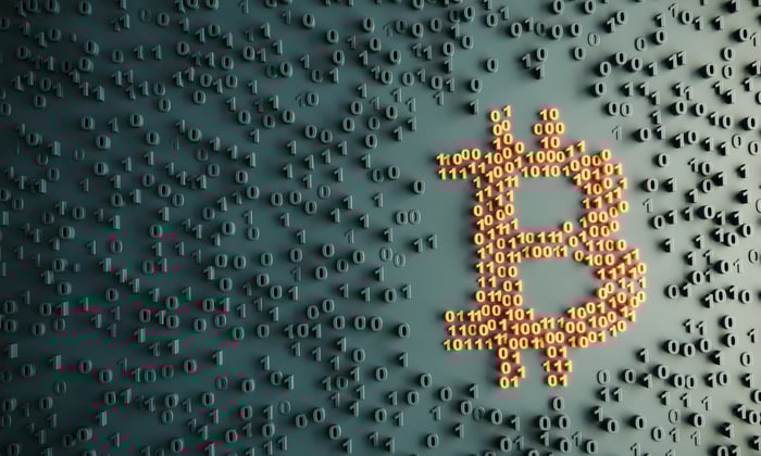 The Bitcoin symbol, constructed from several dozen ones and zeroes.