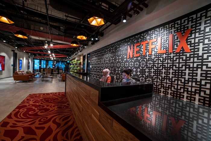 A reception desk with the Netflix logo behind it.