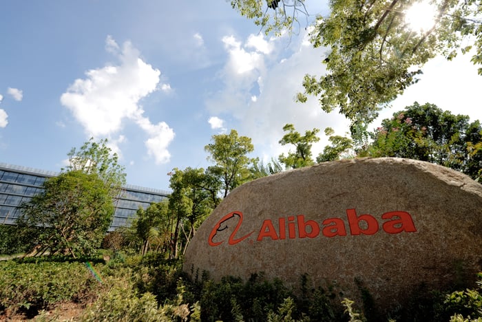 A rock with the Alibaba logo outside of an office
