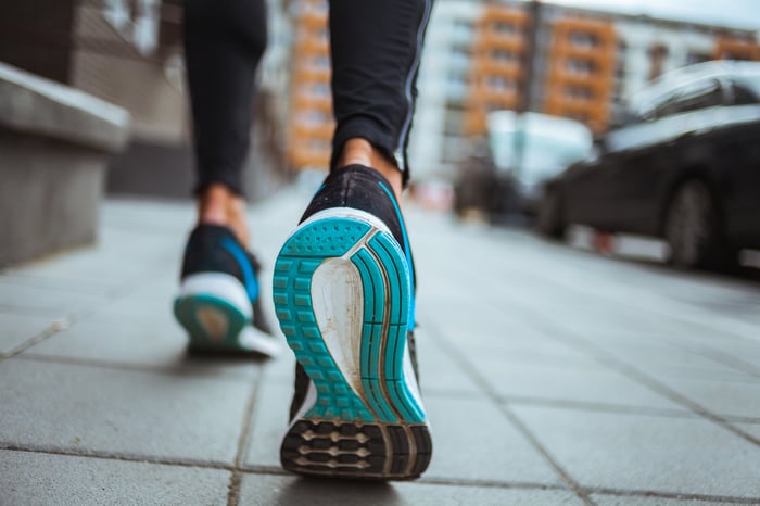 close-up of the bottom of a runner's shoes.