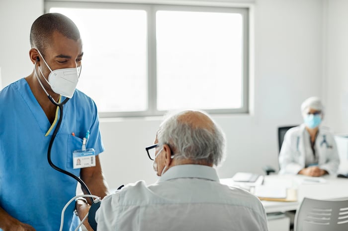 Physician taking care of an elderly patient.