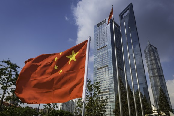 A Chinese flag flies in Pudong, Shanghai.