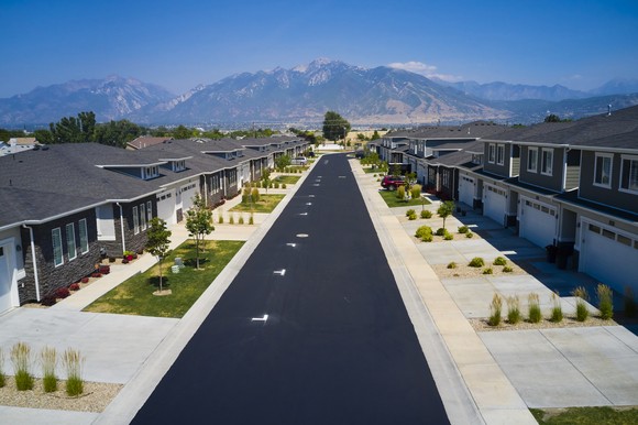 Newly developed neighborhood with mountains in background.