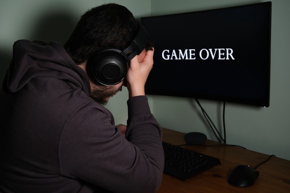 Gamer upset after losing game.