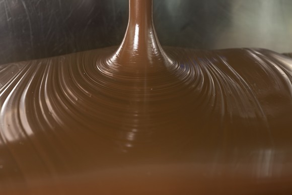 Close-up of melted chocolate being poured.