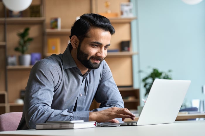 A man looking at a computer.