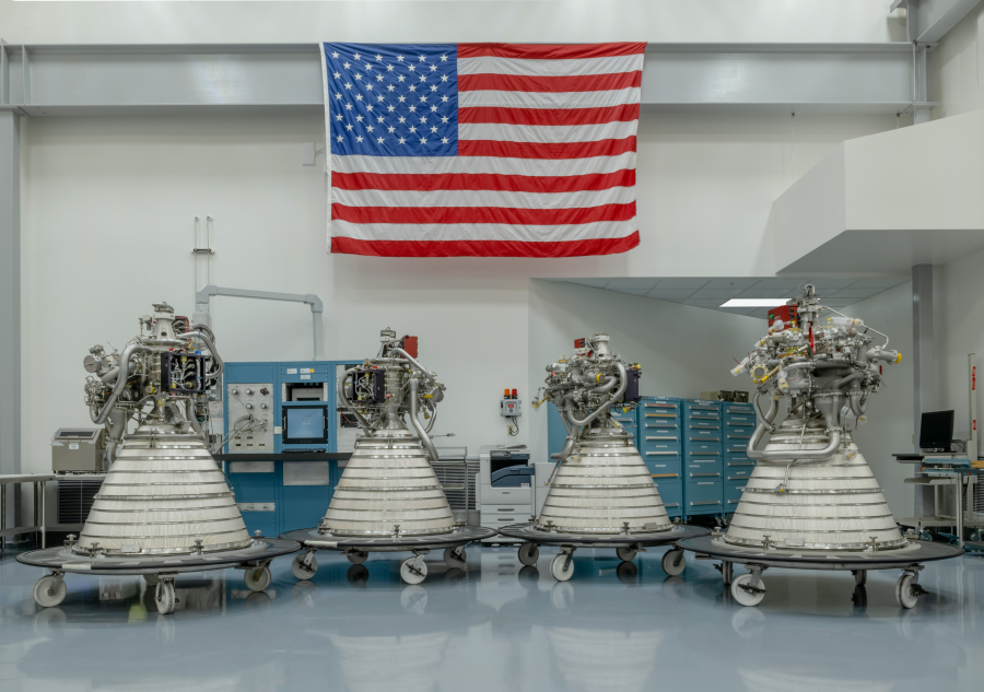 Four RL10 rocket engines lined up on trolleys at the Aerojet Rocketdyne factory. IS AJRD