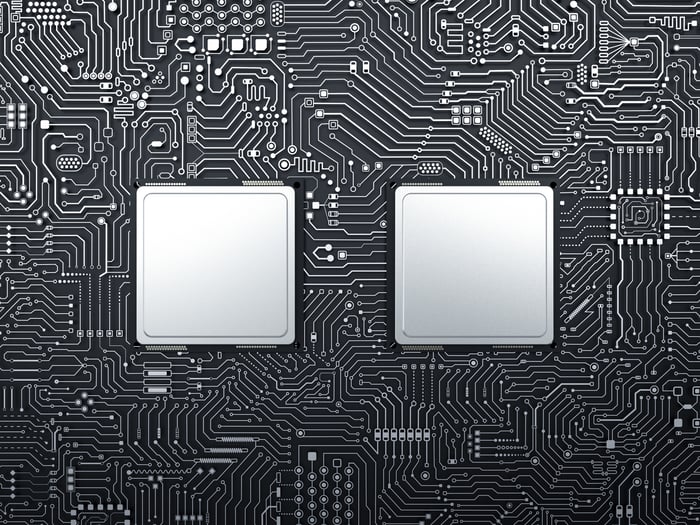 Two semiconductors on a motherboard.