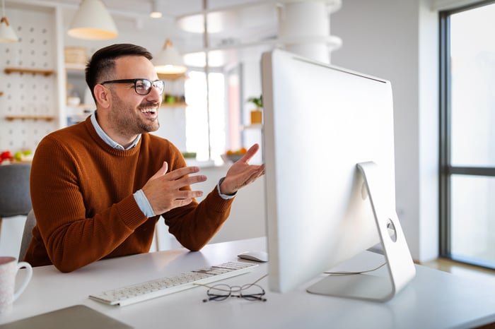 A person looking at a computer screen.