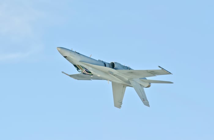 Boeing FA-18C fighter jet flies upside down and sideways.