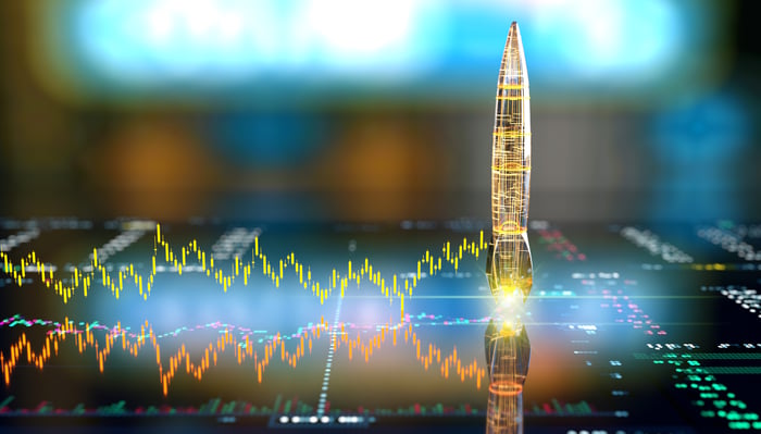 Two diverging charts leading to a digital rocket preparing for launch.