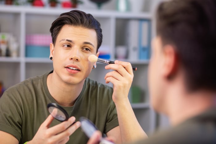 A person putting on makeup.