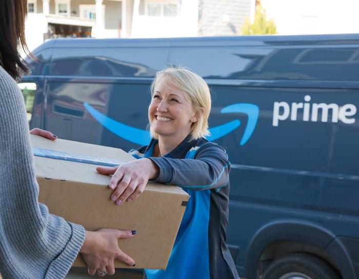 Amazon driver delivering package.