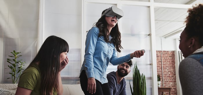 Girl wearing virtual reality headset.