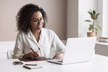 Woman Working on Laptop