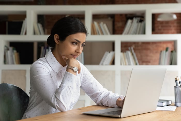 A person at a laptop.