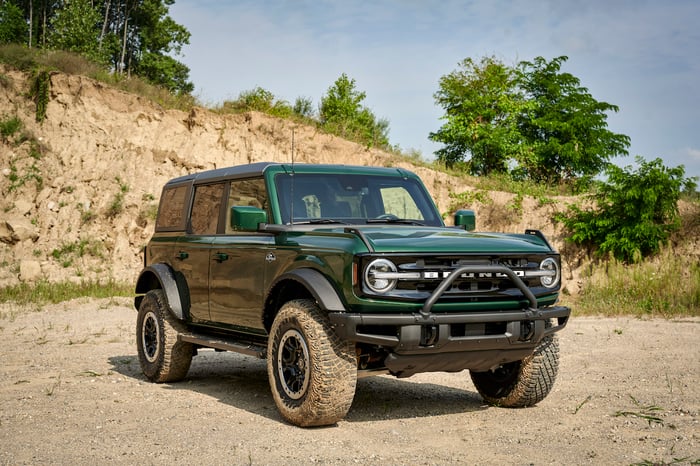 A green SUV outside.