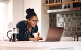 Person looking at data on a laptop.