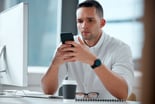 Person reading on  his smartphone.