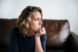 A person looking off, deep in thought.