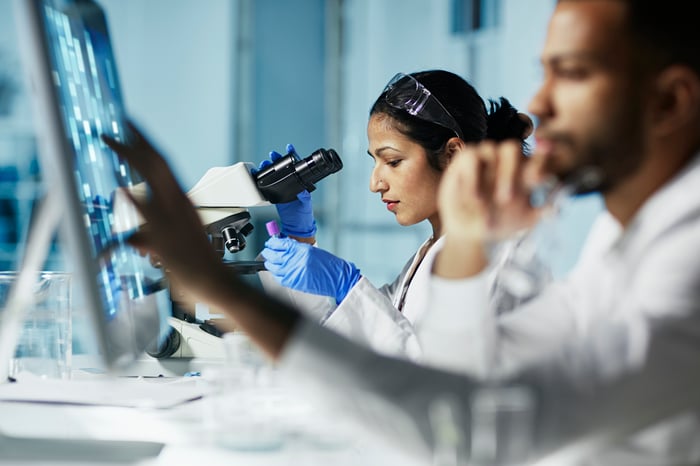 Scientist working on a computer in a laboratory.