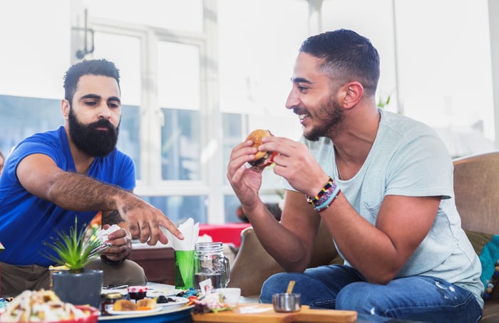 Friends eating burgers.