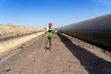 Engineer Checking Gas Pipeline at Construction Site.
