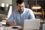 Person doing research on a laptop.