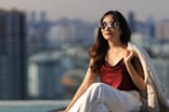 A person looking at view with cityscape behind them.