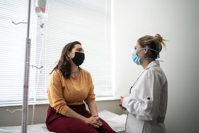 A patient speaks with their doctor at an appointment.