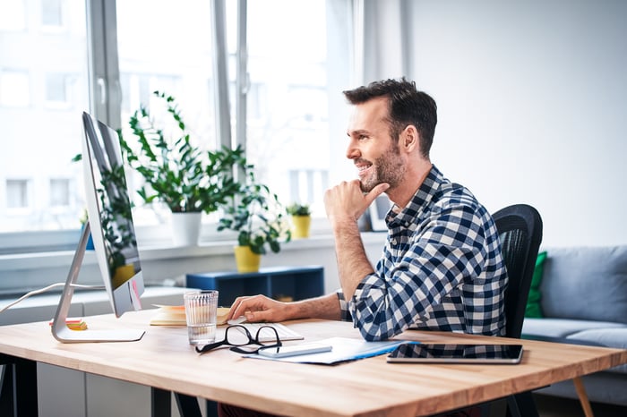 Person sitting at computer.