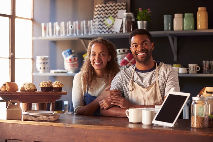 A couple manage their shop.