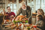 Family at Thanksgiving Dinner -- GettyImages-1396443474