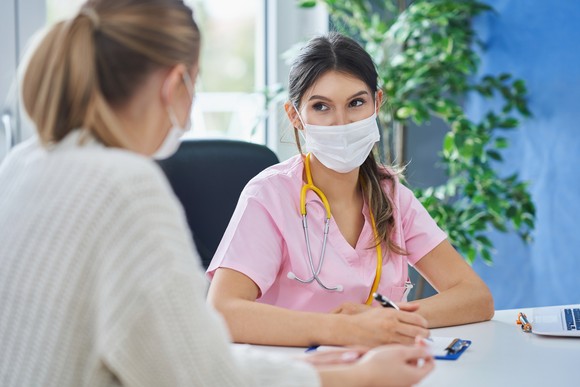A patient attends a doctor appointment during the COVID-19 pandemic.