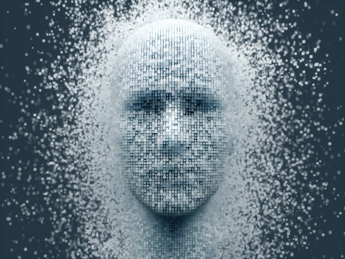 An computerized image of a human face appearing out of thousands of pixels.