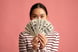 A person holding $100 bills.