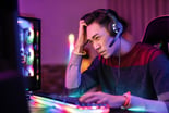 angry gamer playing online on his PC