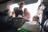 vacation family luggage getty