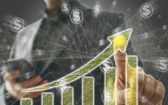 Investor pointing at an upward sloping chart.