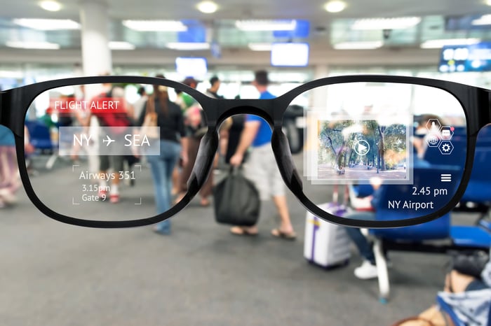 Augmented reality glasses looking at an airport with digital enhancements.