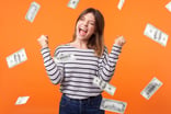 Person excited under money falling all around.
