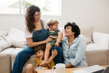 family parents child sofa happy (1)