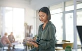 Woman searching online on tablet_GettyImages-1389927343