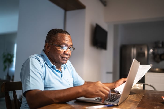 A person at a laptop.