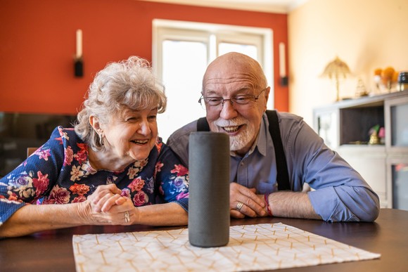 Two people looking at an AI-enabled device.